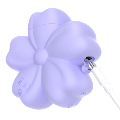 Cherry Blossom vibrator connected to its USB charging cable