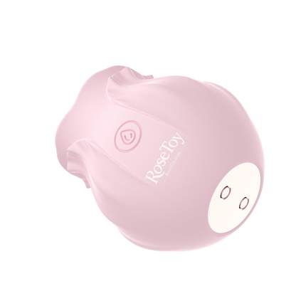Bottom view of the Rose Bloom vibrator showing the magnetic charging contacts